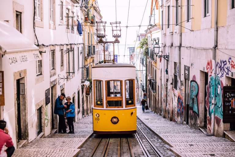 A student travel tour on the famous yellow tram in Lisbon, Portugal.