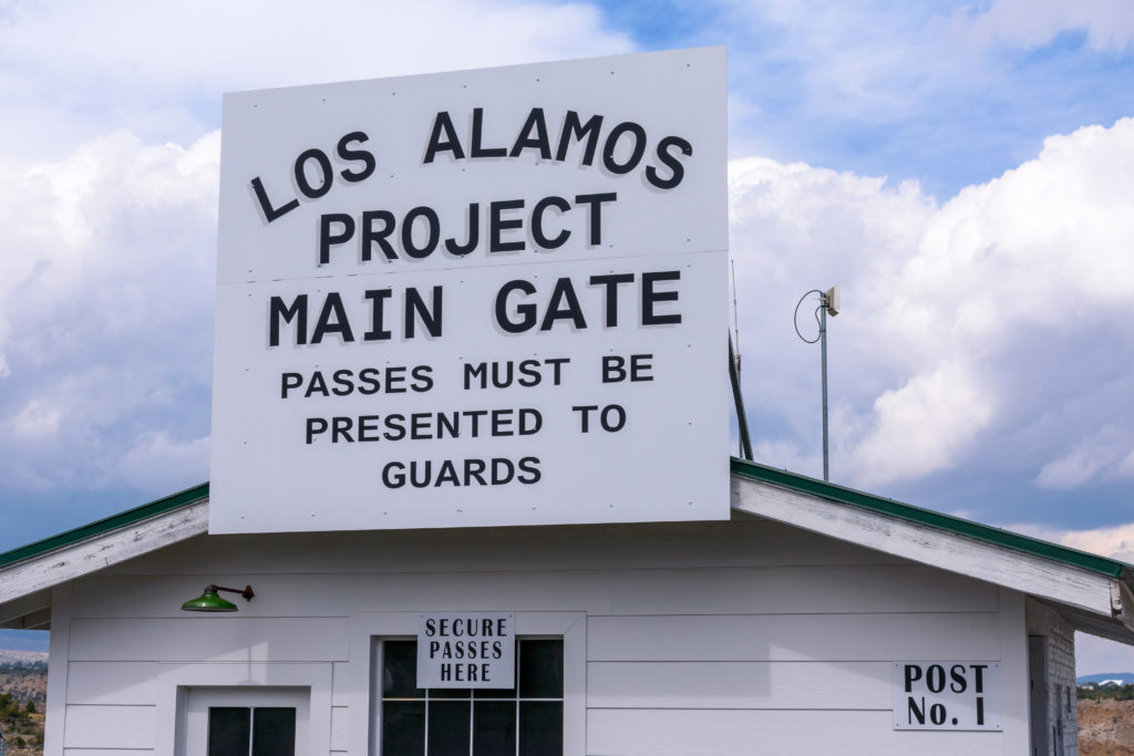 Featured in Oppenheimer Film Locations by Students Fare, this image shows Los Alamos Project Main Gate sign on historic building - Los Alamos New Mexico USA