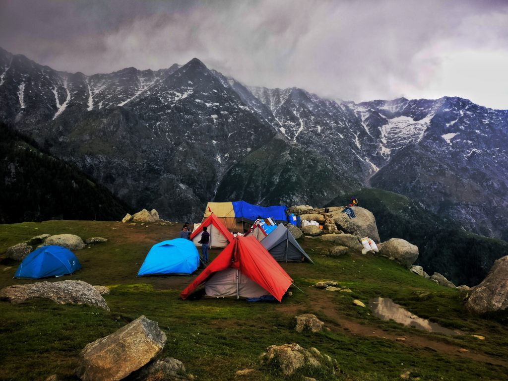 Featured in Backpacking Guide for Students by Students Fare, this image shows a campsite in the mountains.