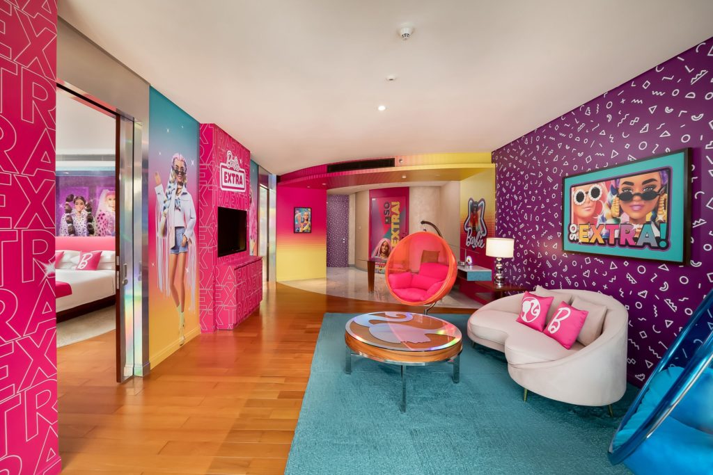 Featured in Barbie Film Locations by Students Fare, this image shows a hotel room done in the style of extra Barbie which is a promotional idea for the premiere of the movie.