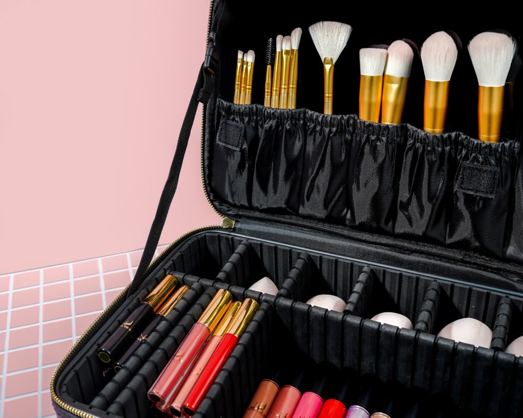 Featured in Packing Guide for Study Abroad by Students Fare, this image shows a makeup bag with toiletries and makeup that students bring on travel.