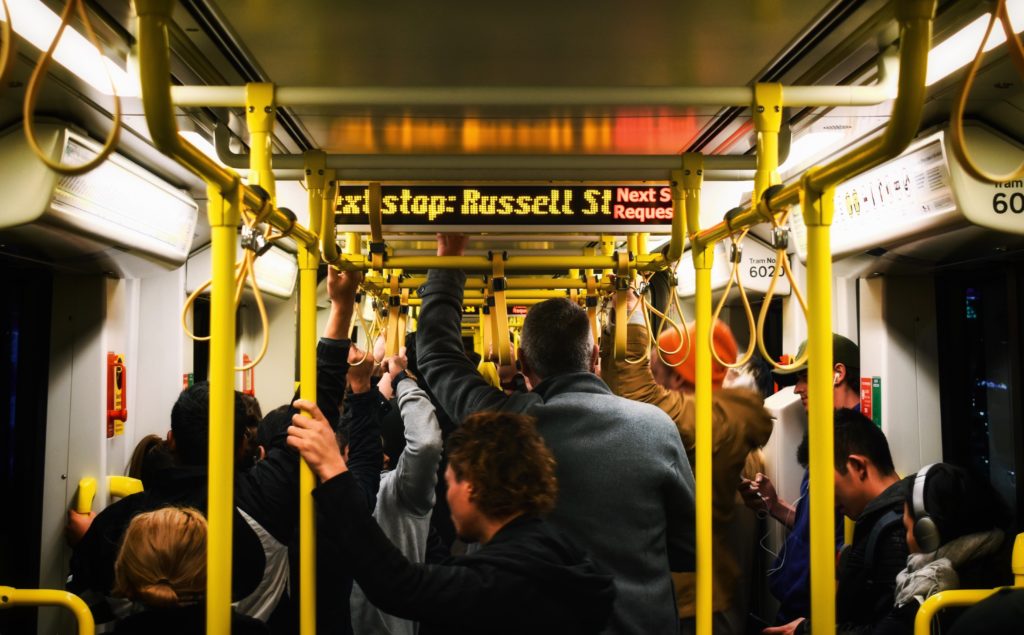 Featured in Tourist Scams to Avoid by Jaya Travel & Tours, this image shows a crowded bus on the inside.