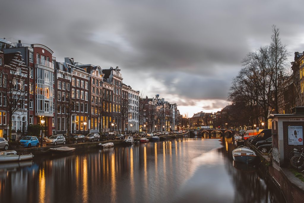 Featured in the Students Fare blog post called best destinations for young travelers, this image is of the waterscape view of amsterdam, netherlands
