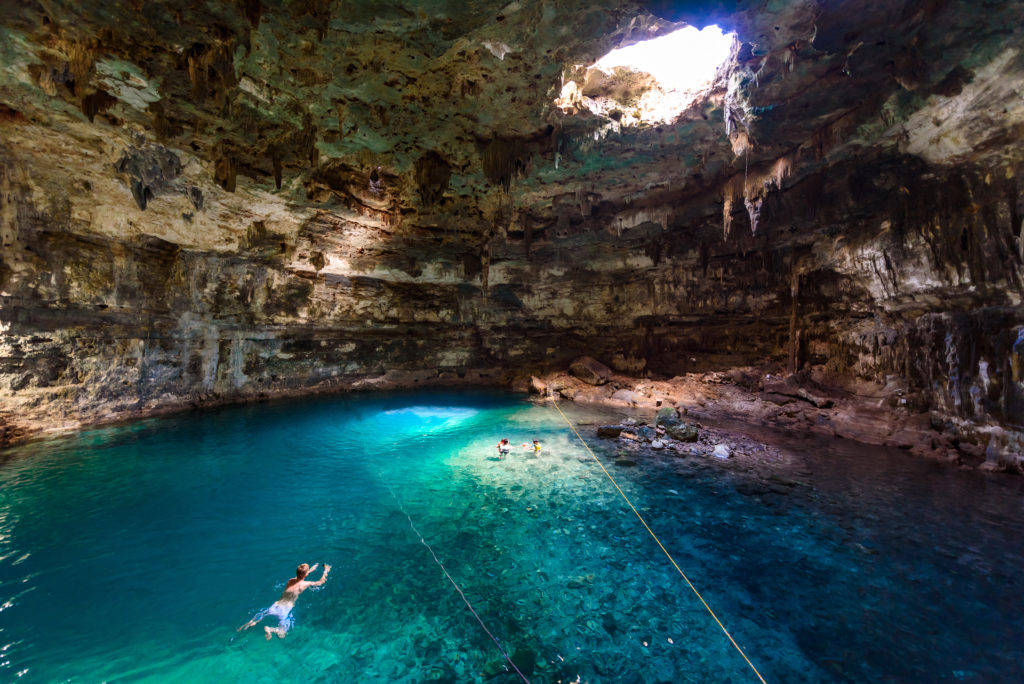 Featured in Students Fare's blog article "Top Cave Explorations for Your Class," which shows Cenote Samula Dzitnup near Valladolid, Yucatan, Mexico - swimming in crystal blue water