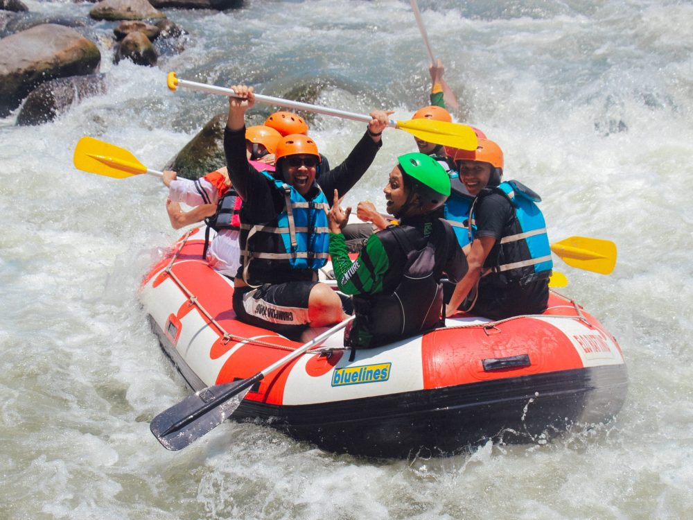 Several student travelers on a rafting tour of the Elo River in Desa Progowati, Magelang, Central Java, Indonesia.