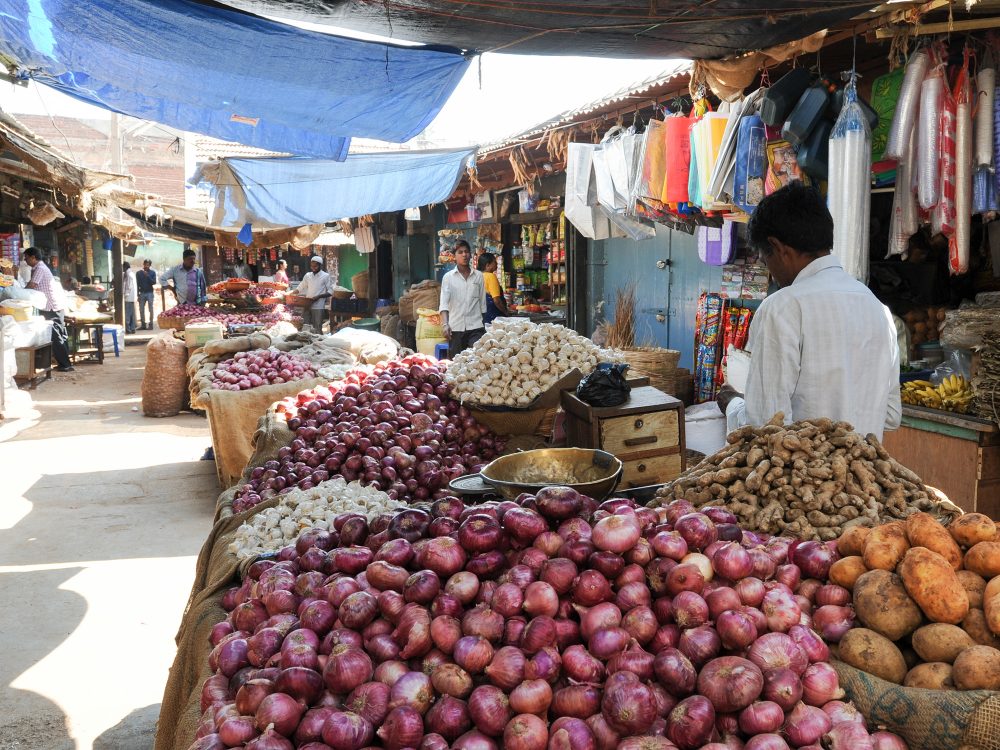 Mysore, India - 23 January 2015:  Indian vendors and customers in the Devaraja vegetable market at Mysore on India